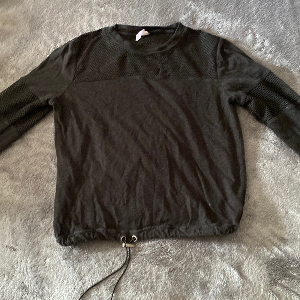 adjustable waist band crop with fish net pieces on arms and chest